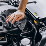 man-polishing-car-inside-car-service (1)